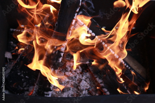 Metal mangal with open fire prepared for outdoor cooking