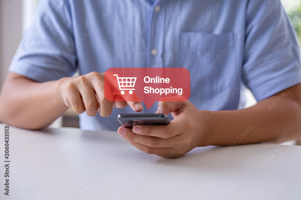 Obraz premium Man Using Smartphone for Online Shopping on Mobile Device Representing E-commerce and Digital Purchase Concept