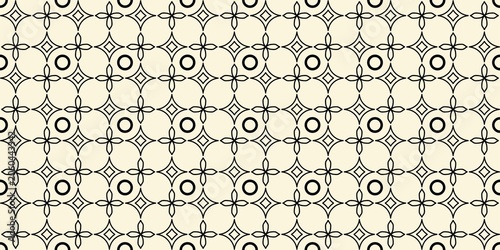 ​Elegant black and white geometric seamless pattern with abstract floral shapes, stars, and circles on a cream background. Perfect for textile design.