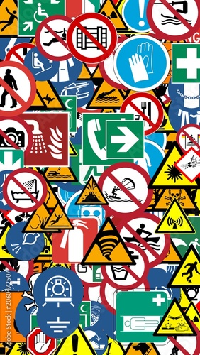 Collage of international safety signs warnings and emergency symbols as a background