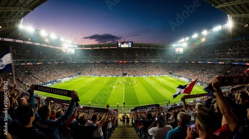 Excited football fans cheer during a thrilling evening match in a packed stadium