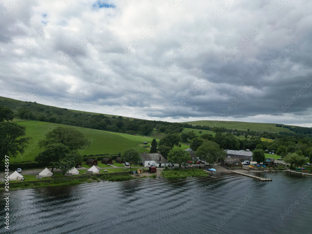 Fototapeta premium Aerial View of Lake Districts Valley and Mountains of UK. Drone Camera View Was Captured From Medium High Altitude During Mostly Dramatic Cloudy Day of Summer 2026