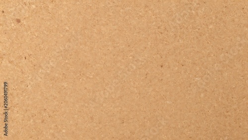 Close-up textured of light brown cork material with small speckles surface