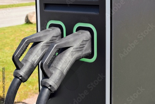 Photos Fast charging station for electric vehicles in the parking lot.