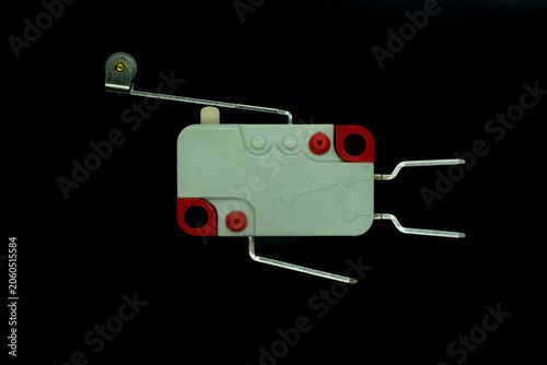 Electronic micro limit switch with roller lever on black background