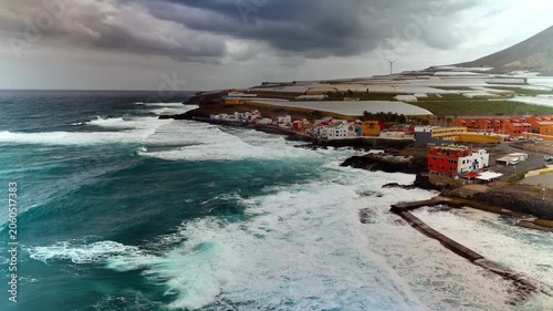 Aerial descent towards El Agujero coastal town and natural pools, Galdar, Gran Canaria