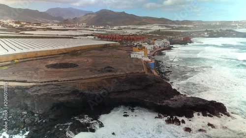 Aerial view of La Guancha archaeological site and crashing waves, Galdar, Gran Canaria