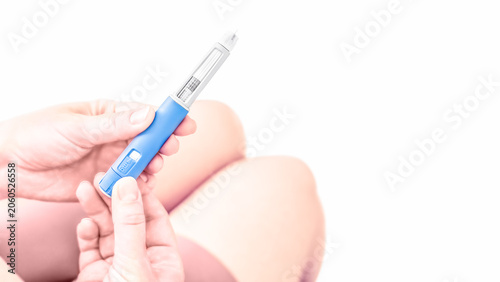 Woman Adjusting GLP-1 Weight Loss Injection Pen Before Self Administration
