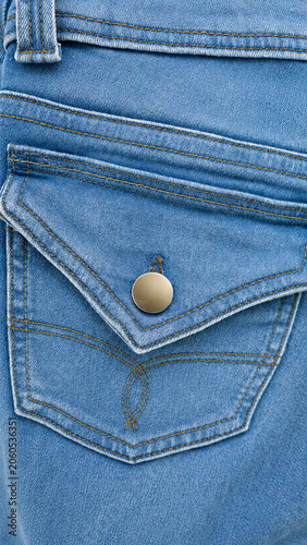Blue Denim Jeans Back Pocket Close-Up with Metal Button Fastener