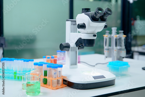 Laboratory Microscope and Test Tubes for Scientific Research and Analysis