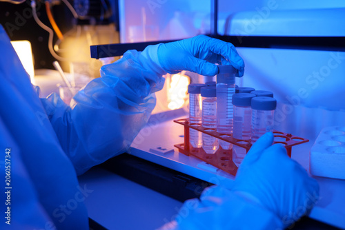 Laboratory Technician Organizing Test Tubes for Scientific Experiments