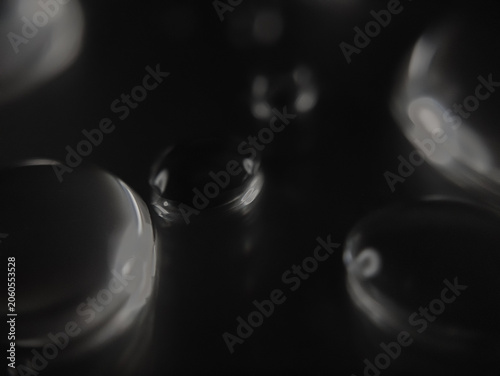 close up of some water droplets on a black and white background