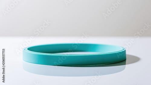 Round blue band placed on a flat surface in a well-lit area during daytime