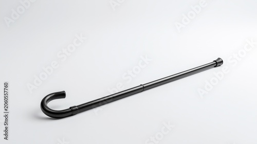 Walking cane is placed on a plain surface to show its design and features in a simple manner