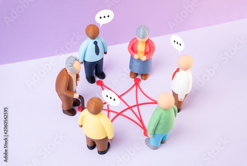 Fotografía Figures of people stand in a circle of connections and communication