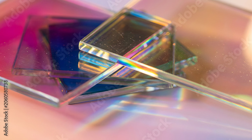 Abstract glass background with light refraction and iridescent rainbow colors