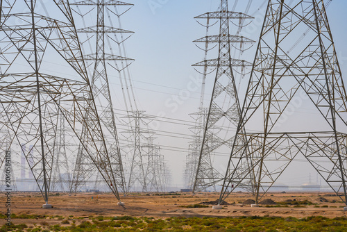 Canvas Print High voltage power lines and electricity pylons in the desert of Saudi Arabia