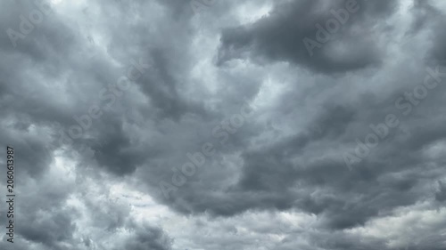 Black and gray clouds cover the sky. Clouds are approaching before a storm and rain with a thunderstorm