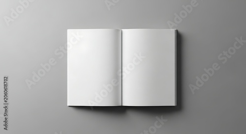 Top view of open blank book mockup on grey background.