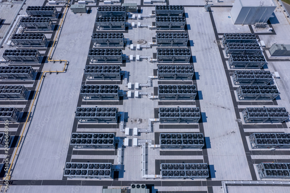 Naklejka premium Aerial view of Hyperscale Datacenter, AI data center cooling systems, piping electrical equipment. Chilling equipment and electrical substations generators