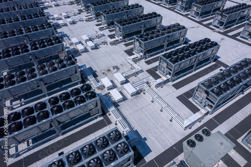 Aerial view of Hyperscale Datacenter, AI data center cooling systems, piping electrical equipment. Chilling equipment and electrical substations generators