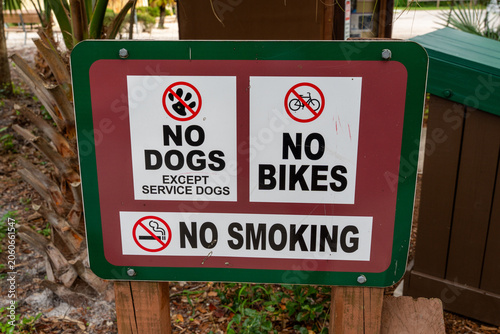 Obraz na plátne Horizontal photo of multiple prohibition signs: no dogs, no bikes, and no smokin