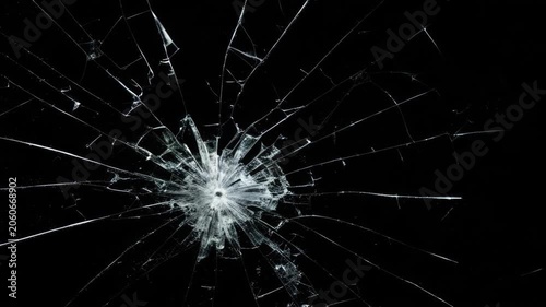 Cracked glass fracture effect on black background. footage of broken glass, crack screen glass.
cracks glass fracture effect texture isolated abstract black background. transparent 4K video.