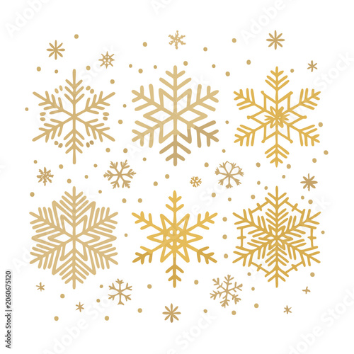 Gold snowflakes and dots on white background