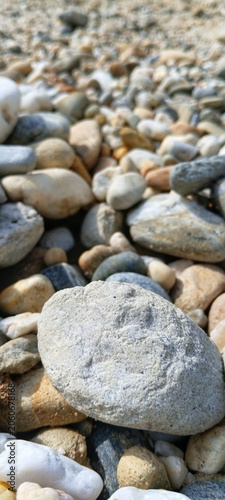 фотографія Sustainable eco-friendly concept featuring raw unpolished river pebbles, suitabl