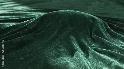 Close-up of luxurious green velvet fabric.
