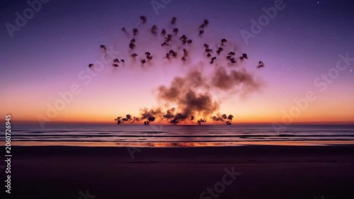 A vibrant fireworks display illuminates the night sky over a serene body of water