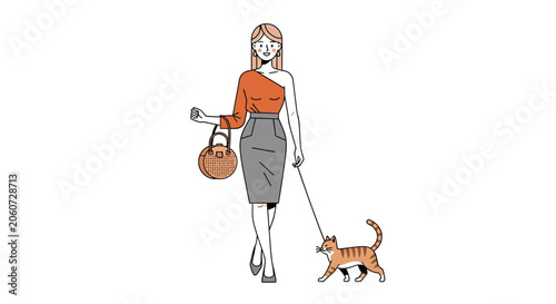 Woman walking her cat on a leash outdoors.