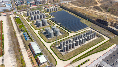 Aerial View of Industrial Tank Farm and Solar Panel Array