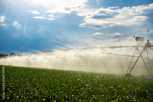 Obraz na płótnie Irrigation boom sprays water evenly