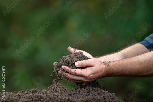 Photos Soil fills human cupped hands