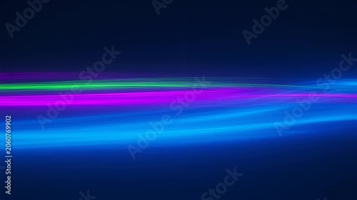 Abstract flowing neon light streaks in purple, green, and blue