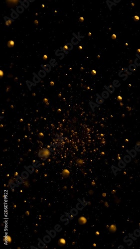 Golden particles floating in darkness, abstract background