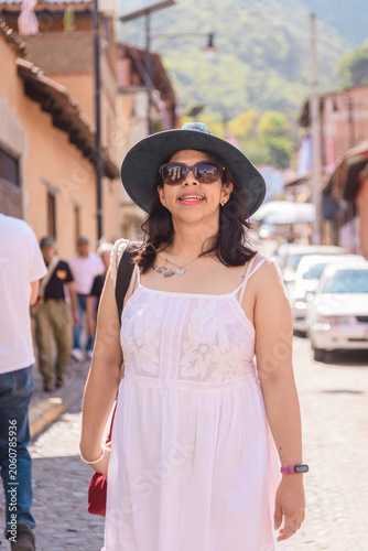 Medium Portrait of Smiling Woman Walking in a Mexican town Malinalco Street