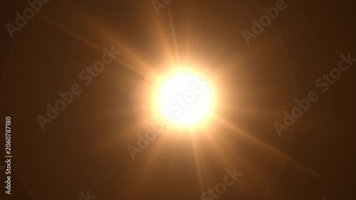 Abstract bright light burst with optical lens flare,Bright explosion of fire and light in a starry night sky with a optical lens flare.