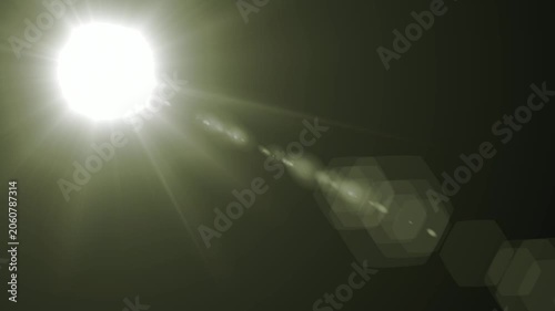 Abstract bright light burst with optical lens flare,Bright explosion of fire and light in a starry night sky with a optical lens flare.