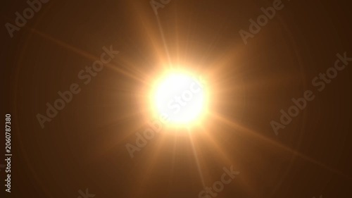 Abstract bright light burst with optical lens flare,Bright explosion of fire and light in a starry night sky with a optical lens flare.