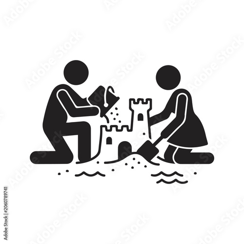 Two children building sand castle.. couple. man and woman