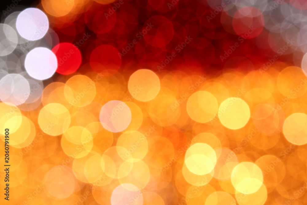 Fototapeta premium Sunset-toned bokeh background transitions from deep red at top to glowing amber and yellow below. Layered light circles create rich, luminous depth, great for seasonal banners or warm mood overlays