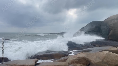 Waves and giant rocks at the Stone Park in Hainan, China
