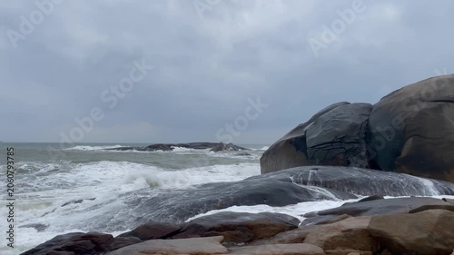 Waves and giant rocks at the Stone Park in Hainan, China