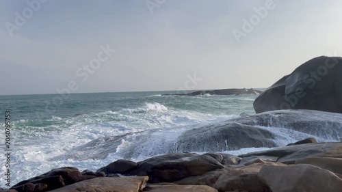 Waves and giant rocks at the Stone Park in Hainan, China