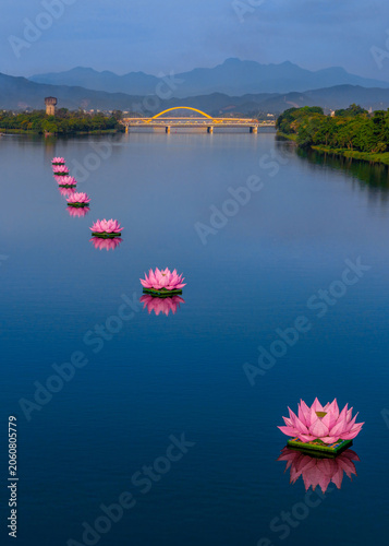 фотографія Beautiful vertical landscape of Perfume River in Hue city, Vietnam, featuring a
