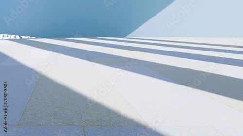 Smooth stone platform under diffused bands of light with a cool blue sky, conveying a solemn memorial atmosphere for quiet reflection and background use