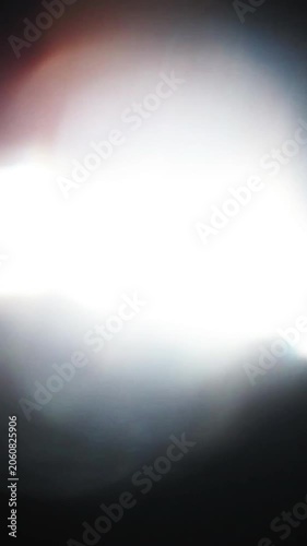 Fast vertical light leak transition bokeh effect for video footage