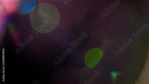 Photos Rich purple and pink bokeh lights bloom across a dark background, creating a mystical, romantic, and alluring atmosphere with soft, glowing, out-of-focus circles